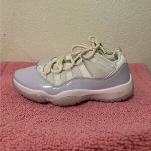 Women’s white and lavender Jordan 11